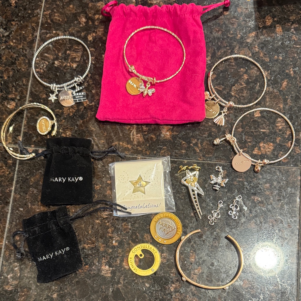 Assorted Mary Kay Charm Bracelets And Consultant Pins 25$